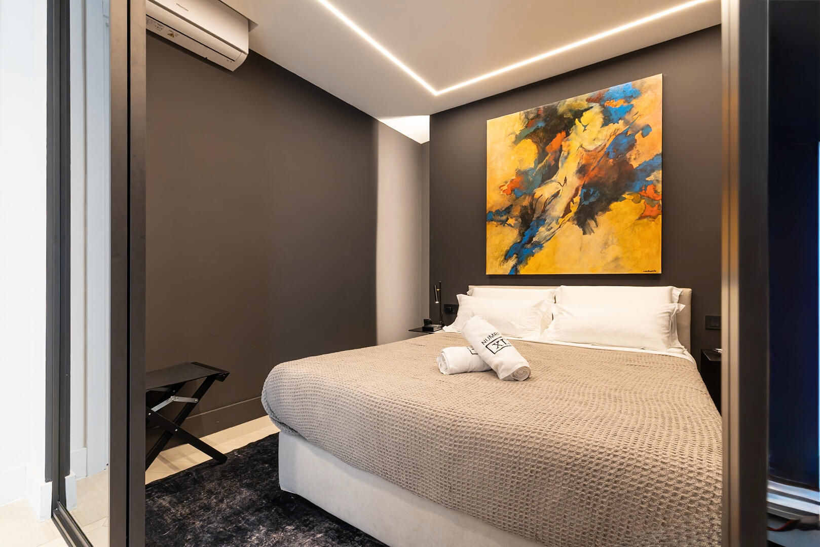 King-size bed with premium linens ensures restful sleep.